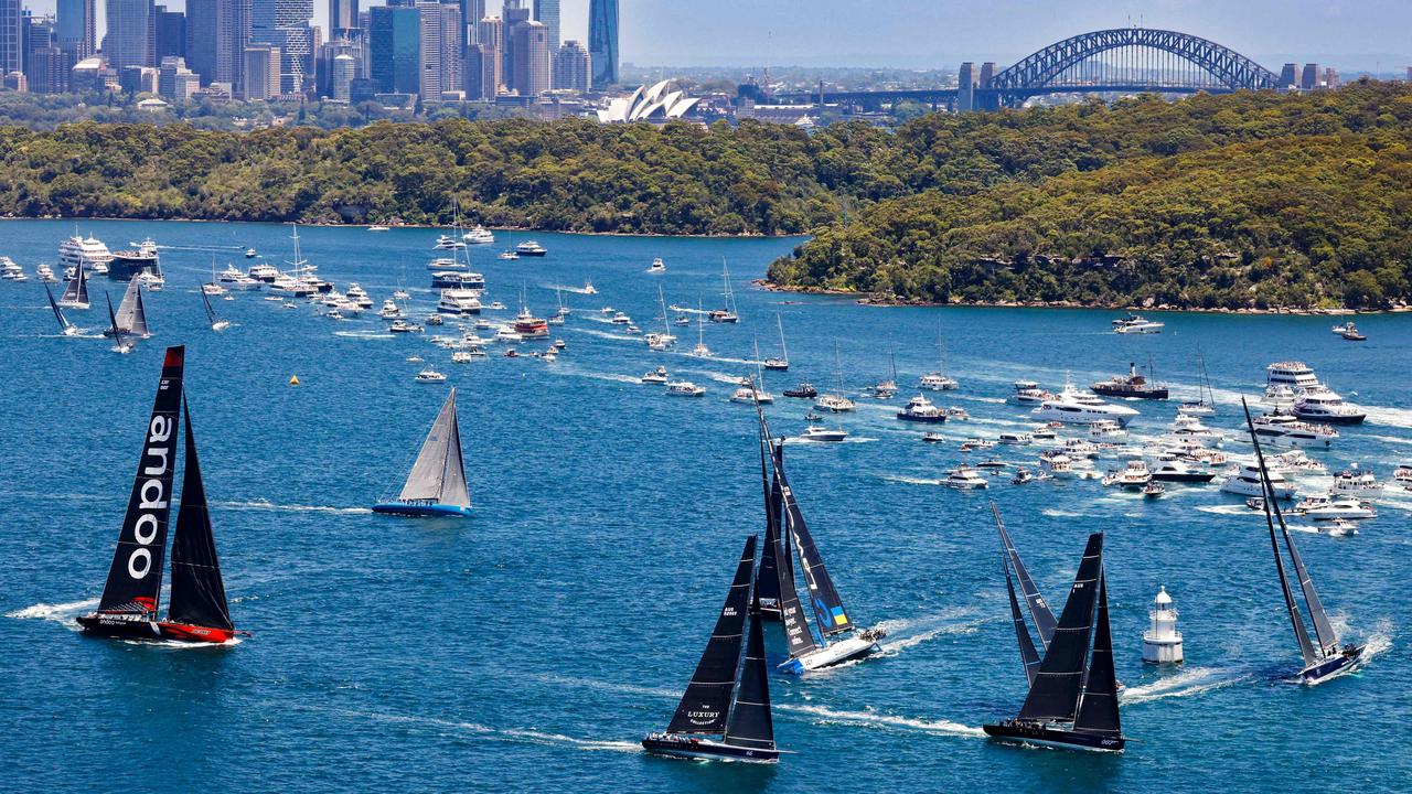 Yachts sailing out of Sydney harbour at the start of the Sydney to Hobart yacht race. (Photo by Carlo Borlenghi / ROLEX / AFP).<b/>