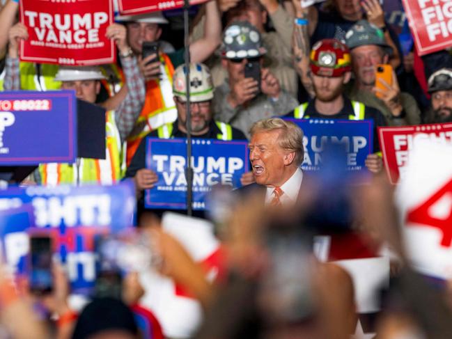 TOPSHOT - Former US President and Republican presidential candidate Donald Trump reacts as he arrives for a rally at 1st Summit Arena at the Cambria County War Memorial in Johnstown, Pennsylvania, on August 30, 2024. (Photo by ROBERTO SCHMIDT / AFP)