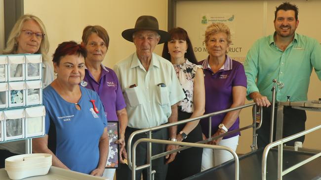 Salvatore ‘Sam’ Catalano (centre) donated $25,000 to Innisfail Hospital through his charitable foundation so the facility was able to purchase a motorised trolley for safe patient transport between the emergency department and the helipad. Picture: supplied