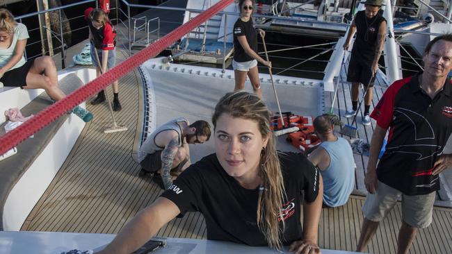 Bonnie Martin, centre, the crew of Passions of Paradise and operator Alan Wallish, right, are keeping everything shipshape despite having no tourist clients. Picture: Brian Cassey