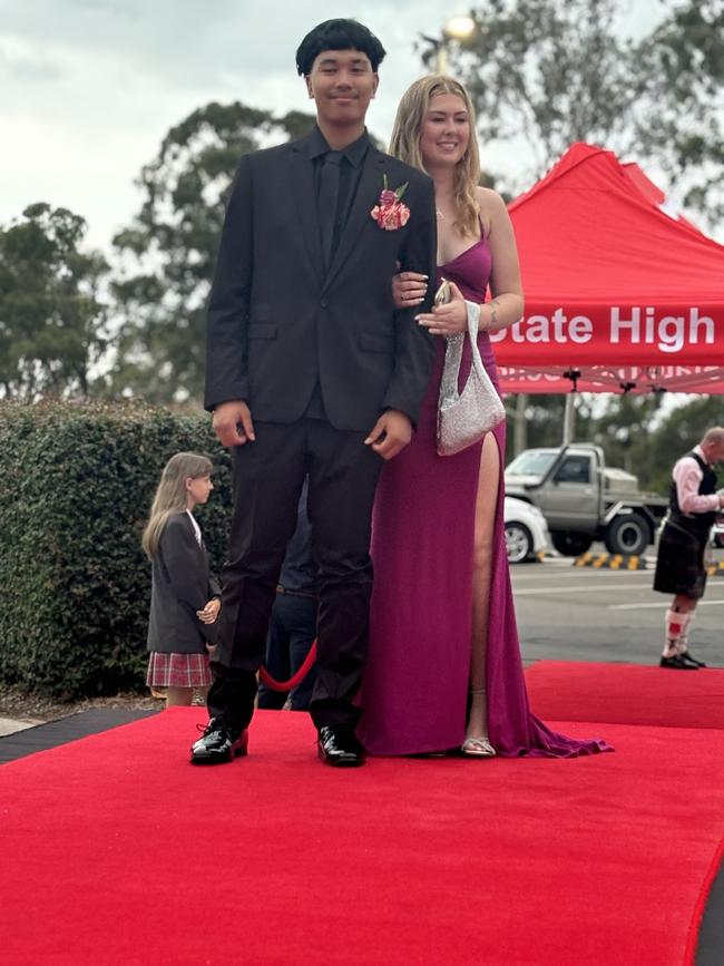 Students from Urangan State High School arrive at their formal.