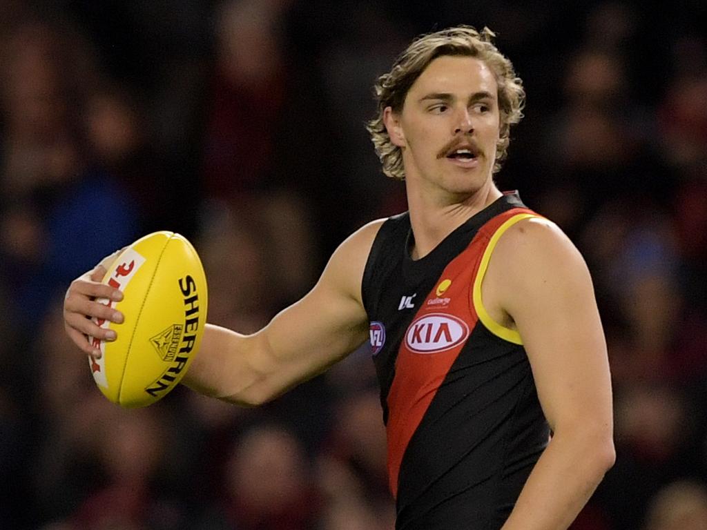 Joe Daniher of the Bombers after taking a mark over Luke McDonald of the Kangaroos during the round 18 men's Essendon Bombers and the North Melbourne Kangaroos match at Etihad Stadium, in Melbourne, Saturday, July 22, 2017. (AAP Image/Tracey Nearmy) NO ARCHIVING