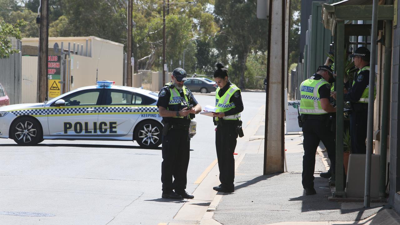 Police outside the Thebarton scrap metal yard after the crash. Picture: Emma Brasier
