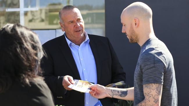 Independent candidate Paul Funnell talks to a voter at pre-poll for the Wagga Wagga byelection. Picture: Dylan Robinson