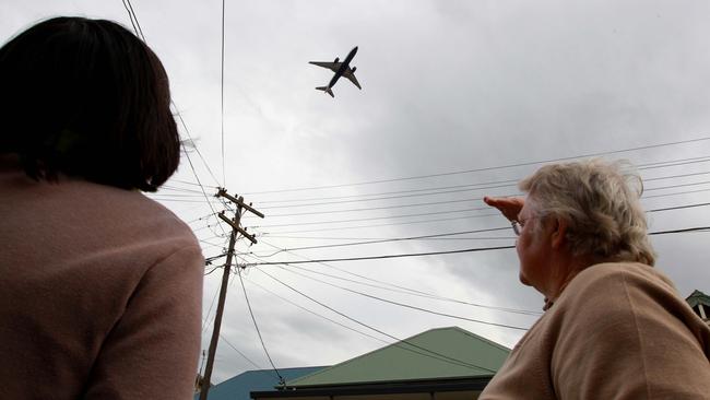 Planes fly over Sydenham after taking off from Sydney Airport.