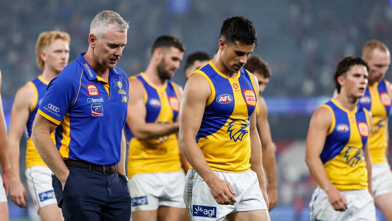 MELBOURNE, AUSTRALIA - MARCH 31: Adam Simpson, Senior Coach of the Eagles and Liam Duggan of the Eagles leave the field after a loss during the 2024 AFL Round 03 match between the Western Bulldogs and the West Coast Eagles at Marvel Stadium on March 31, 2024 in Melbourne, Australia. (Photo by Dylan Burns/AFL Photos via Getty Images)