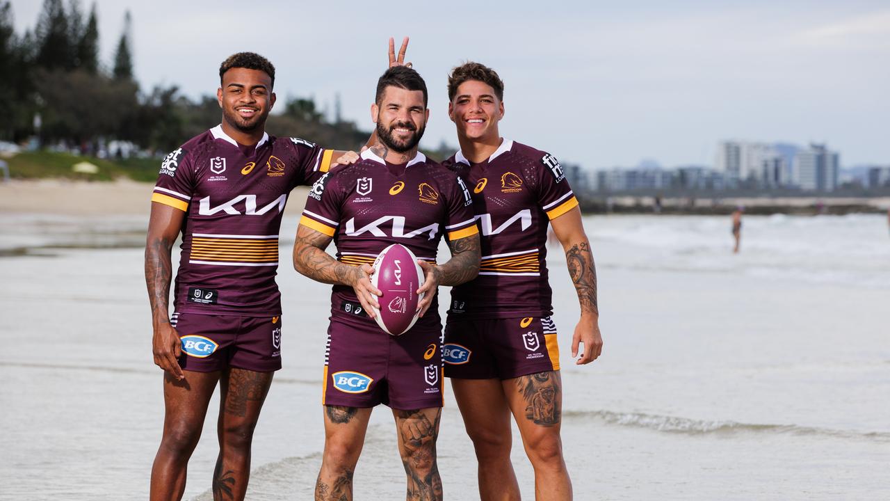 Broncos players Ezra Mam, Adam Reynolds and Reece Walsh on the beach at Mooloolaba on the Sunshine Coast where the Broncos will play two trial matches in 2023. Picture Lachie Millard