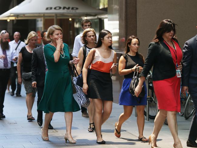 6. Calm in the middle of the unfolding drama, workers in surrounding offices are evacuated as the city’s financial heart goes into lockdown. Picture: Toby Zerna