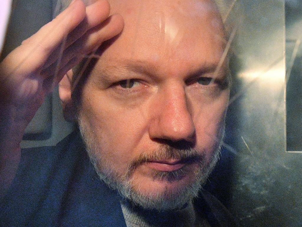 WikiLeaks founder Julian Assange gestures from the window of a prison van as he is driven out of Southwark Crown Court in London on May 1, 2019. Picture: Daniel Leal-Olivas/AFP