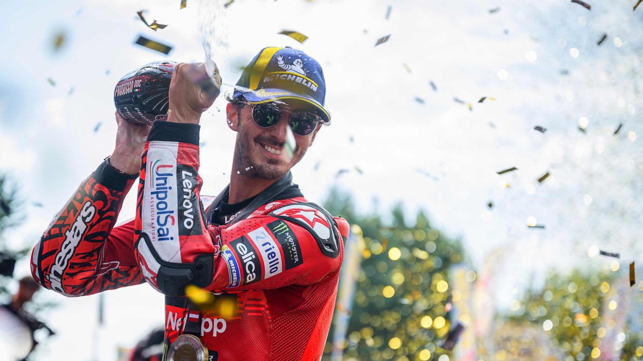 Ducati Lenovo Team's Italian rider Francesco Bagnaia celebrates on the podium after winning the Tissot Sprint Race of the Austrian MotoGP weekend at the Red Bull Ring racetrack in Spielberg, Austria on August 17, 2024. (Photo by Jure Makovec / AFP)