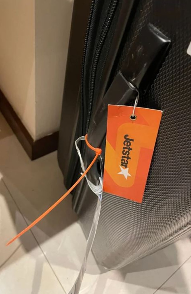 A woman travelling from Sydney to Bali on a Jetstar flight noticed her suitcase had an orange cable tied to one of the handles, taking to Facebook seeking answers. Picture: Facebook/Balibogans