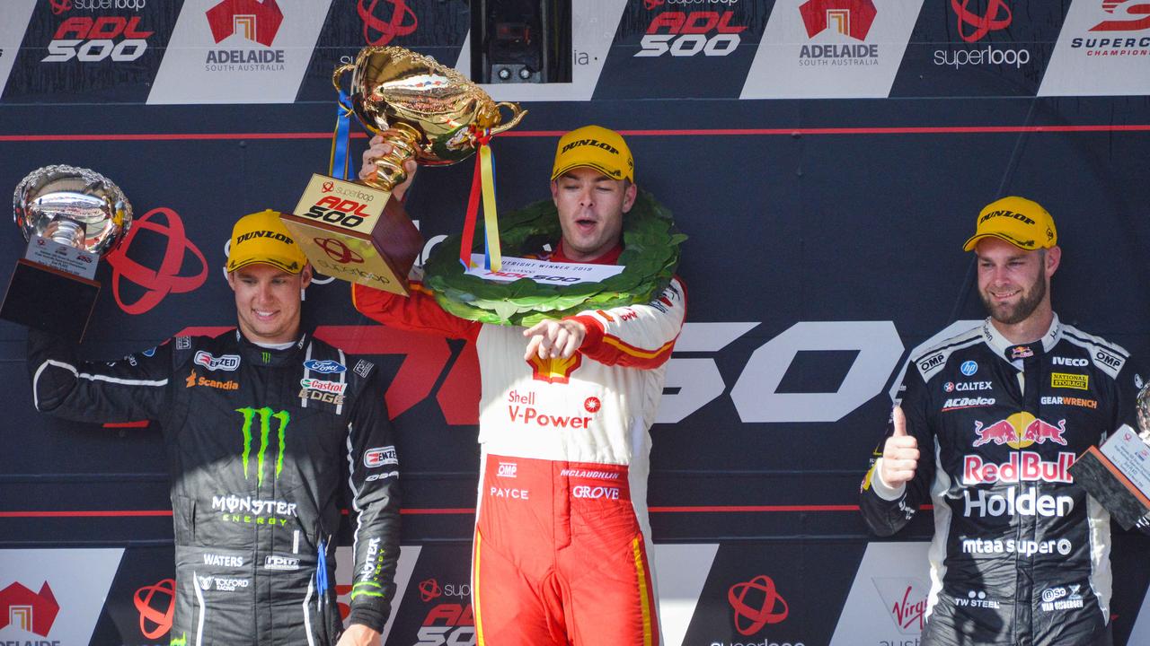 Scott McLaughlin celebrates winning Race 2 of the Superloop Adelaide 500 flanked by Cam Waters and Shane van Gisbergen. Picture: Brenton Edwards/AAP