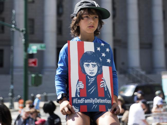 A child holds a sign during the rally to protest the Trump administration's immigration policies Saturday, June 30, 2018, in New York City. Picture: AP Photo/Kevin Hagen