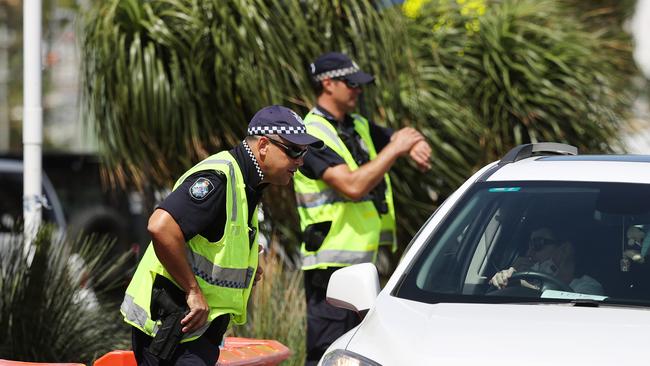 Police at the Queensland border in Griffith Street, Coolangatta. Picture: NIGEL HALLETT