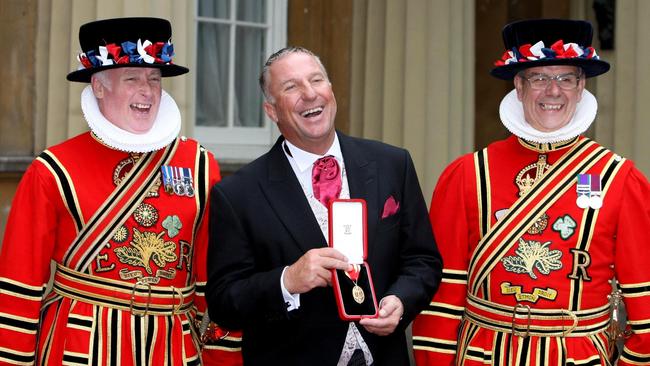 Sir Ian Botham after he received his knighthood from Britain's Queen Elizabeth II at Buckingham Palace, London in 2007.