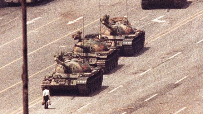 The famous picture of a man blocking a convoy of tanks at Tiananmen Square on June 5, 1989.