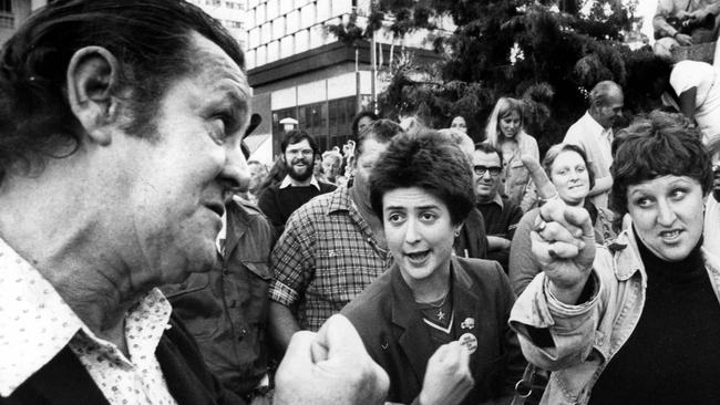 A bystander at King George Square challenges two civil rights protesters who were urging people to vote on the right to march issue. The challenger told them he had fought for the country and would not take part in their protest.