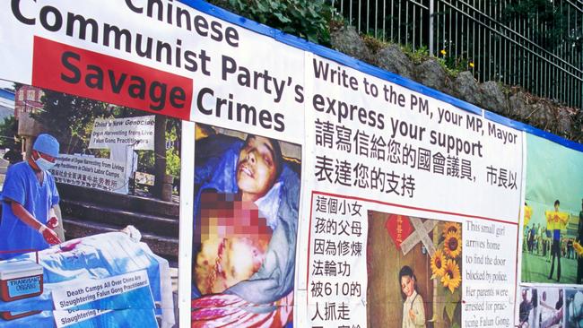 Chinese prisoners are the main source of organs for transplants in China, a new report reveals. Here, signs are pictured inside the Chinese consulate in Vancouver, Canada. Picture: Alamy Live News