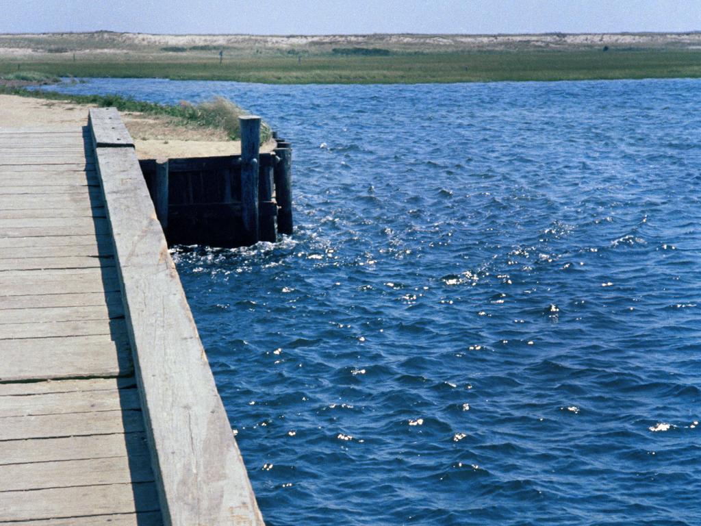 In this file photograph from 1969, skid marks and deck damage is seen on the Dyke Bridge on Chappaquiddick Island in Edgartown, Mass., where U.S. Sen. Edward Kennedy's car plunged off the bridge. It's been 50 years since the fateful automobile accident that killed a woman and thwarted Kennedy's presidential aspirations. Picture: AP Photo, File.