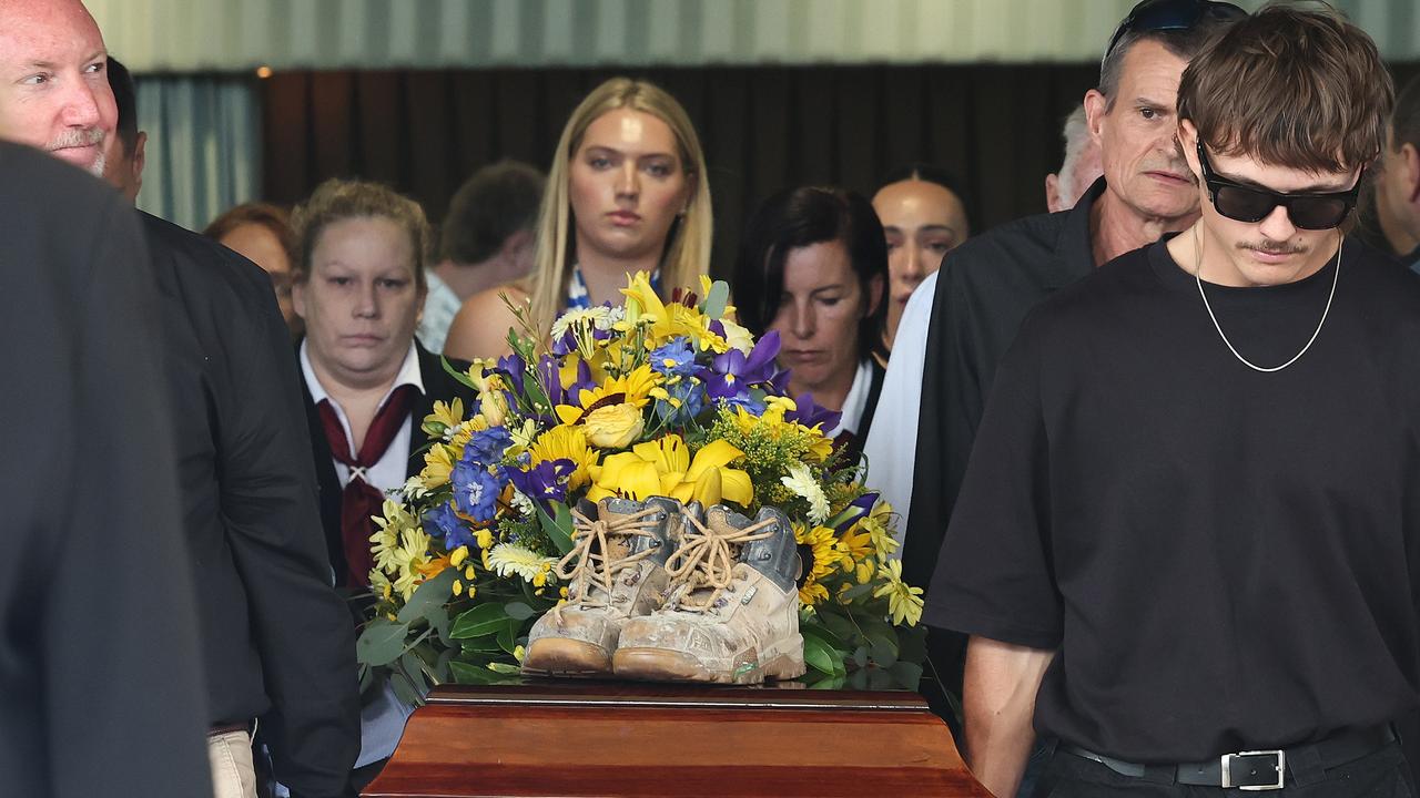 Cameron Duce’s work boots sat atop his coffin during a funeral service on the Gold Coast today. Picture Glenn Hampson