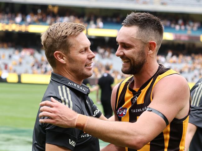 MELBOURNE.  20/03/2022.   AFL. Round 1.  Hawthorn vs North Melbourne at the MCG . .  Sam Mitchell, senior coach of Hawthorn. Hugs Jack Gunston after todays win . Photo by Michael Klein