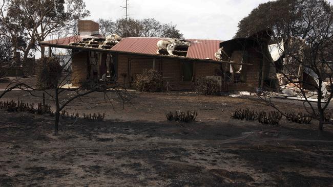 A partly destroyed house near Stokes Bay. Picture: AAP / Emma Brasier