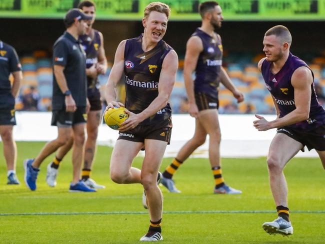 Hawthorn Hawks player James Sicily(left) is seen during a training session at the Gabba, Friday, May 31, 2019. (AAP Image/Glenn Hunt) NO ARCHIVING