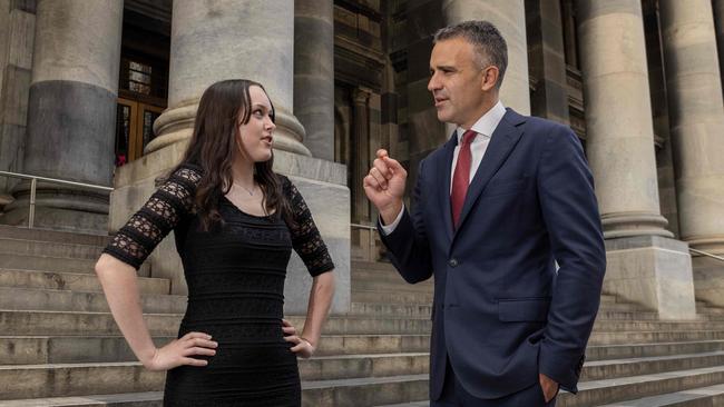 Chloe Wyatt-Jasper with Premier Peter Malinauskas on the steps of parliament. Picture: Kelly Barnes