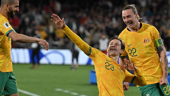 Australia's Craig Goodwin celebrates scoring a goal during the FIFA World Cup 2026 Asia zone qualifiers football match between Australia and China in Adelaide on October 10, 2024. (Photo by Brenton Edwards / AFP) / -- IMAGE RESTRICTED TO EDITORIAL USE - STRICTLY NO COMMERCIAL USE --