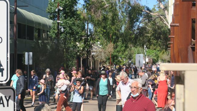 Crowds followed the tail end of the parade as it made its way to the Todd riverbed. Picture: Laura Hooper.