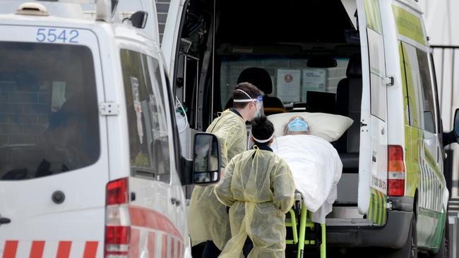 Ambulance staff transport residents from Epping Gardens Aged Care at the height of the second wave. Picture: NCA NewsWire / Andrew Henshaw