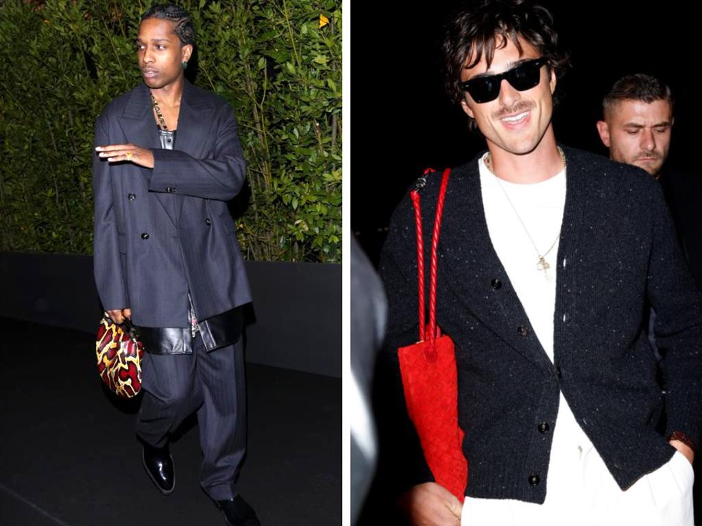 Rapper A$AP Rocky and actor Jacob Elordi show off their Bottega Veneta purses that retail for up to $12,000 as they arrive at the luxury brand’s Milan Fashion Week show.