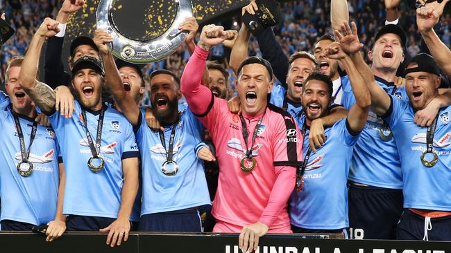 Sydney FC raise the Trophy after winning on penalties during the A League Grand Final, Sydney FC v Melbourne Victory at Allianz Stadium, Sydney. pic Mark Evans