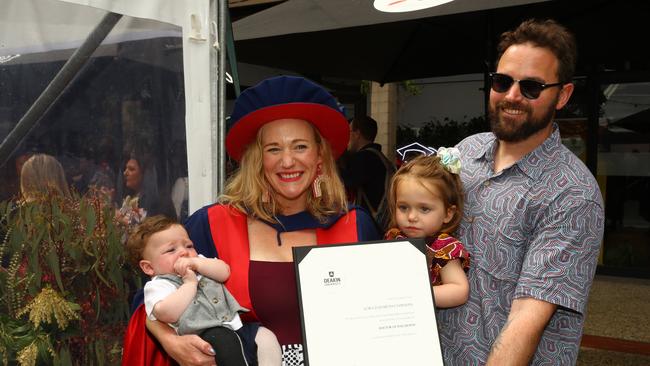 Lora Chapman with her children Leonard 5 months and Evelyn, 2, and husband Alex Monte at the Deakin University Graduation post ceremony celebration. Picture: Alison Wynd