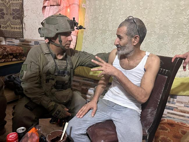 Kaid Alkadi with the commander of the 162nd Division BG Itzik Cohen after his rescue at an undisclosed location in the southern Gaza Strip. Picture: AFP