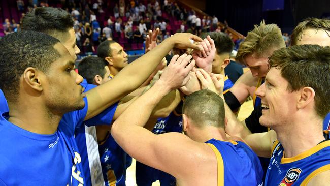 Bullets players celebrate their important win over the Hawks.