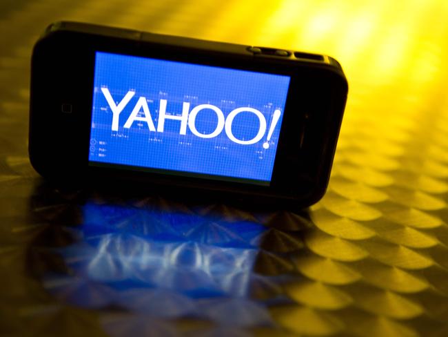 (FILES) This file photo illustration taken on September 12, 2013 shows the Yahoo logo seen on a smartphone. Yahoo slashed the price of its core Internet business in the sale to Verizon by $350 million following a pair of major data breaches at Yahoo, the two companies announced on February 21, 2017. Under revised terms of the delayed deal, Verizon's purchase the Yahoo assets will now total $4.48 billion. Yahoo still faces probes and lawsuits related to the cyber attacks, which affected more than 1.5 billion accounts. / AFP PHOTO / KAREN BLEIER