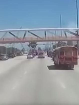 Cars drive towards the bridge moments before its collapse. Picture: OfficalJoelF/YouTube