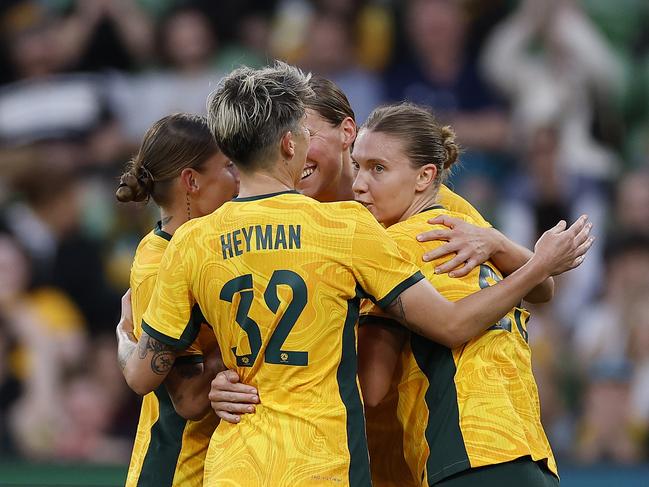 Natasha Prior is mobbed by teammates after scoring her first goal for Australia. Picture: Getty Images