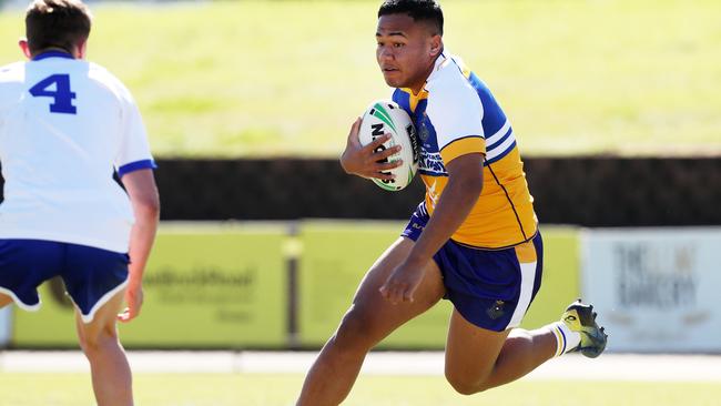 Lafaele Tauapai looks to step around the St Dominic’s defender Declan Quirk. Picture: Jonathan Ng