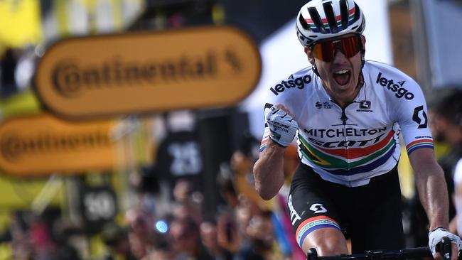 South Africa's Daryl Impey celebrates as he wins on the finish line of the ninth stage of the Tour de France. Picture: Jeff Pachoud/AFP.