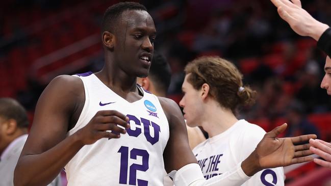 DETROIT, MI — MARCH 16: Kouat Noi #12 of the TCU Horned Frogs high fives teammates during the first half against the Syracuse Orange in the first round of the 2018 NCAA Men's Basketball Tournament at Little Caesars Arena on March 16, 2018 in Detroit, Michigan. (Photo by Elsa/Getty Images)