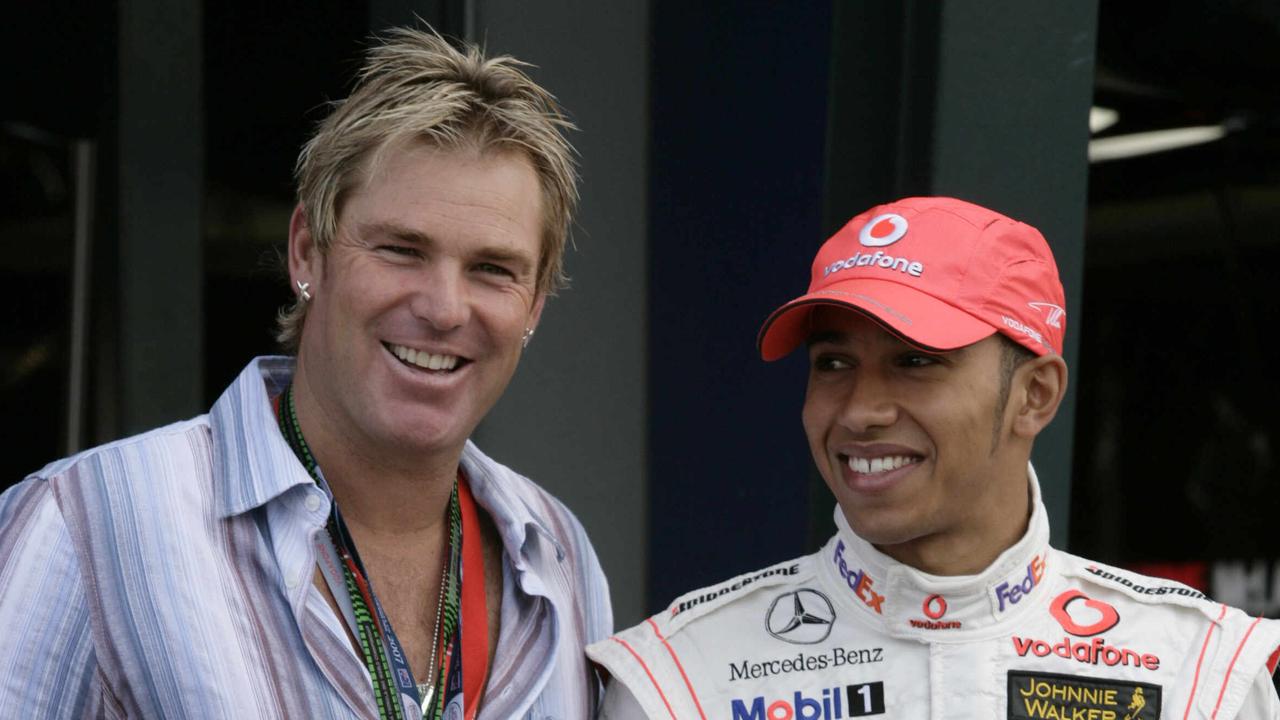 Australian cricket legend Shane Warne with Hamilton at the 2007 Melbourne Grand Prix.