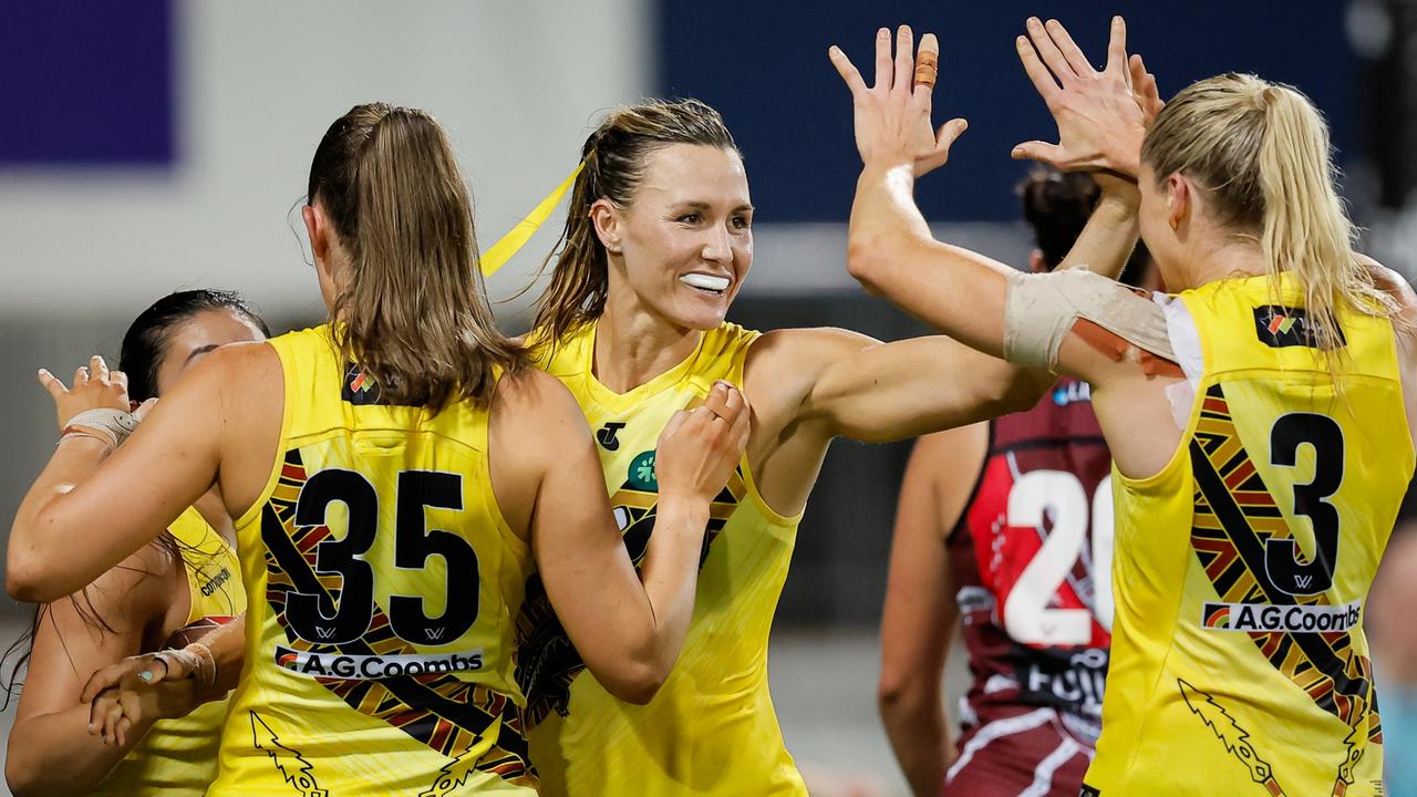 Eilish Sheerin of the Tigers celebrates a goal with teammates during the 2024 AFLW Round 09 match between the Essendon Bombers and the Richmond Tigers at TIO Stadium on October 26, 2024 in Darwin, Australia. Picture: Dylan Burns/AFL Photos via Getty Images