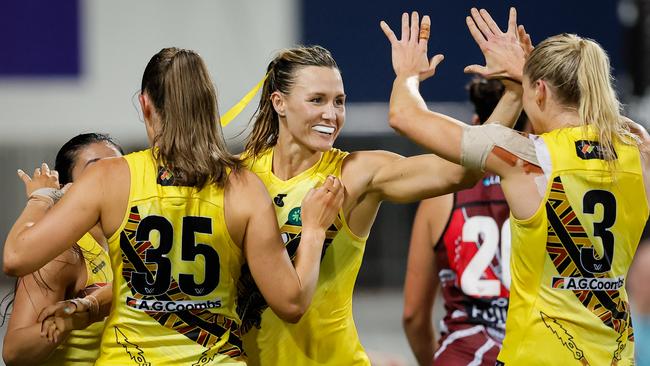 Eilish Sheerin of the Tigers celebrates a goal with teammates during the 2024 AFLW Round 09 match between the Essendon Bombers and the Richmond Tigers at TIO Stadium on October 26, 2024 in Darwin, Australia. Picture: Dylan Burns/AFL Photos via Getty Images