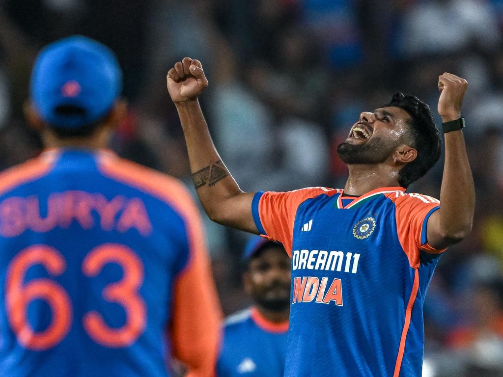 India's Harshit Rana celebrates after taking the wicket of England's Jamie Overton. Picture: INDRANIL MUKHERJEE / AFP