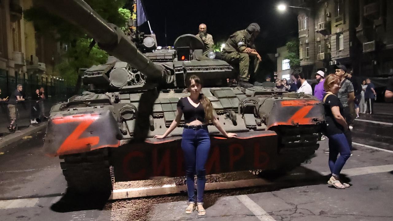 A woman poses for a photo in front of a Wagner Group military vehicle in Rostov-on-Don, Russia. Picture: Feodor Larin/Anadolu Agency via Getty Images)