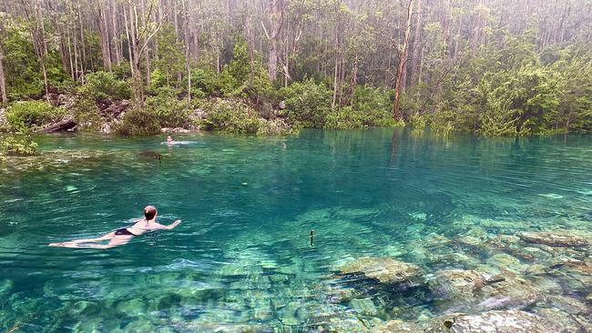 Grace Holligan and friends going for a swim in the Disappearing Tarn on Mt Wellington/kunanyi. Picture: MATT HOLLIGAN