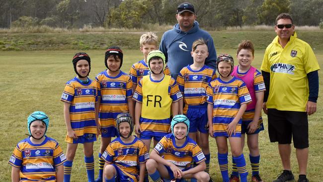 Marcus Hillier (middle at back) with the Norths Blue under-9 rugby league team he coaches. Picture: Gary Reid