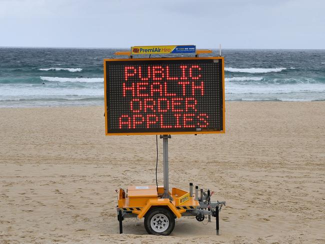 A public health order notice at Bondi Beach.